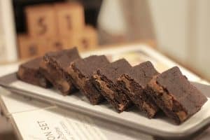 Row of fudgy chocolate brownies on a tray at Cafe Arte