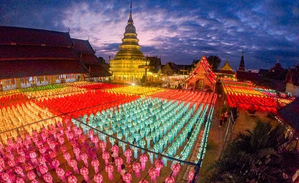Hanging lanterns surrounding the golden chedi at Hariphunchai