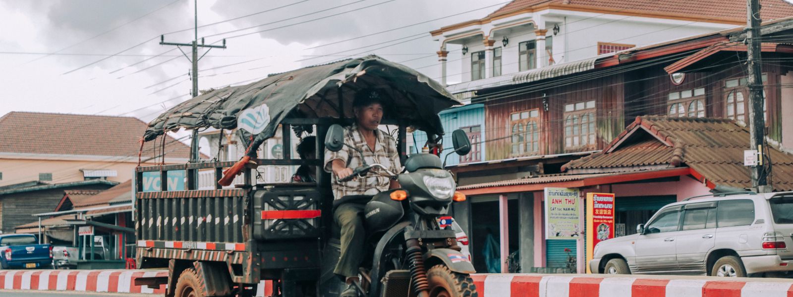 A tuk tuk on a city road